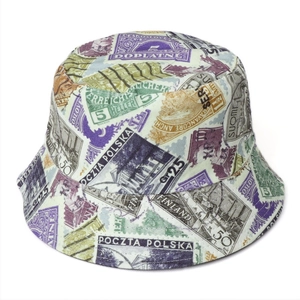 Detailed close-up of retro stamp print patterns on a double-sided bucket hat for outdoors