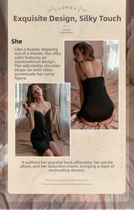 Detail of black satin nightgown showing the deep V-neck and crisscross open back design
