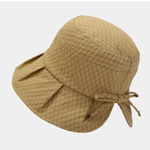Khaki bow sun bucket hat for women with textured fabric and wide wavy brim for sun protection