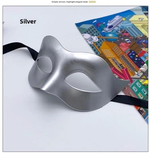 Close-up of silver masquerade half-face mask with matte finish and black silk ribbons
