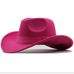 Detail view of the rose red felt cowboy hat featuring a matching satin ribbon band