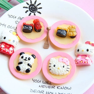 Detailed macro view of resin food miniatures including kitty and panda themed sushi models