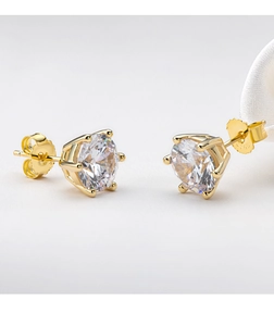 Macro shot of S925 sterling silver gold-plated 6-prong moissanite stud earrings