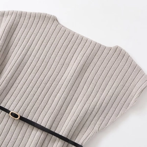 Elegant grey ribbed knit off-shoulder top with a slim black belt and golden buckle