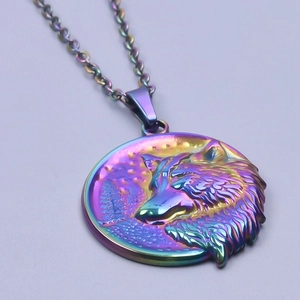 Detailed close-up of rainbow metal pendant with engraved wolf head on stainless steel chain