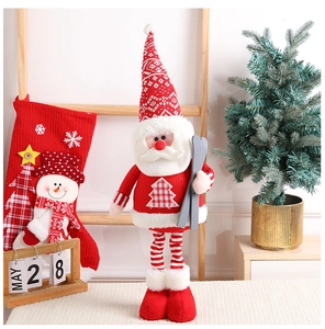 Detail of Santa plush doll with knitted hat, long beard and decorative wooden skis