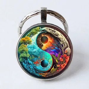 Detailed macro view of Tai Chi Yin Yang art glass dome pendant on a round keychain ring