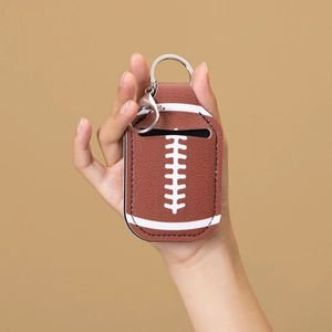 Brown leather American football keychain case with metal ring for hand sanitizer bottles