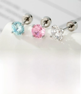 Macro detail of 5mm cubic zirconia earrings in blue pink and clear with 0.8mm surgical steel pin