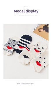Detail of five low-cut cotton socks featuring polka dots, stripes, and heart patterns