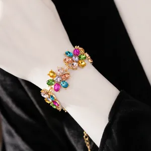 Vintage floral bracelet with colorful crystals and gold metal setting on wrist
