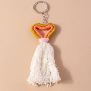Handmade woven heart keychain with orange yellow cotton cord and white tassel