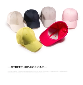 Collection of multi-color cotton baseball caps showing interior structure and stitching