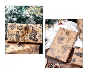 Detailed view of brown kraft wrapping paper with black pine cones and socks prints