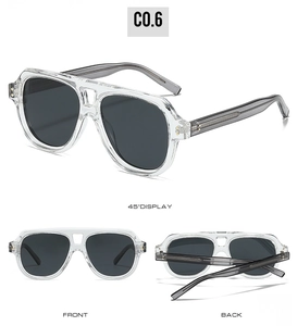 Detail view of transparent pilot sunglasses with internal metal reinforced core and dark lenses