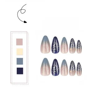 Detail of almond starry sky press-on nails with blue gradient and gold star glitters