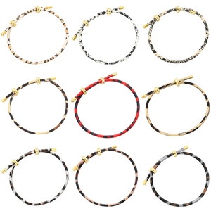 Detailed assortment of animal print adjustable cord bracelets with golden buckles