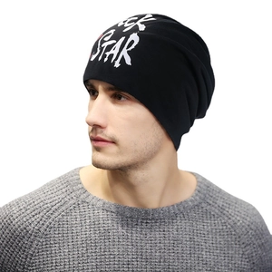 Black beanie for men featuring white Rock Star print in a stylish slouchy fit