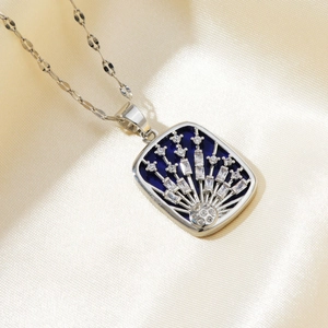 Close-up of shooting star necklace with blue enamel and micro-pave cubic zirconia