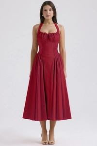 Detail of red halter midi dress with a corset bodice and ruffled trim accents