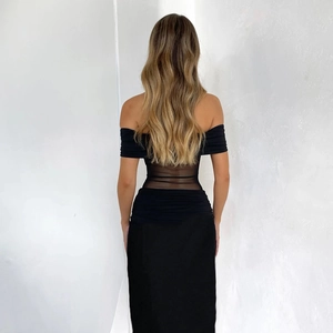 Back view of elegant off-shoulder black dress featuring waist mesh patchwork detail