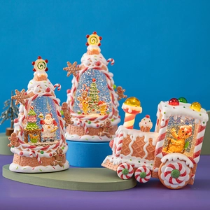 Festive Christmas gingerbread house water globe and candy train tabletop ornaments