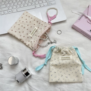 Floral corduroy drawstring storage bags set in pink and beige for jewelry and cosmetics