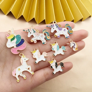 Detail of eight assorted colorful enamel unicorn alloy pendants for DIY jewelry making