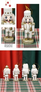 Detail of four 10cm white and gold wooden nutcracker soldier ornaments for Christmas trees