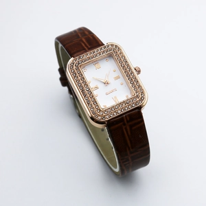 Square rose gold watch with diamond bezel, white dial and brown leather strap