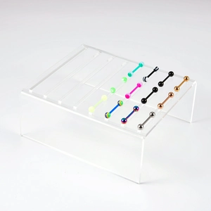 Présentoir en acrylique avec piercings droits en acier inoxydable de couleurs variées