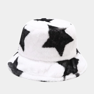 Detail of plush bucket hat featuring fuzzy faux fur texture and black star patterns