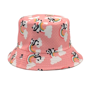 Close-up of pink sun hat with cute panda and rainbow patterns on high-quality cotton fabric