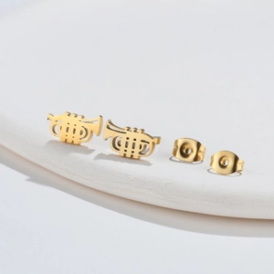 Detailed side view of golden trumpet music earrings with secure metal butterfly backings