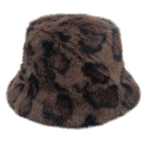 Detail of plush faux fur leopard print bucket hat with soft texture and warm winter design