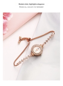 Detail of rose gold quartz watch with diamond bezel and adjustable drawstring heart strap