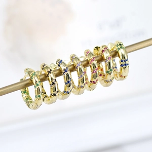 Golden hoop earrings with multi-colored cubic zirconia inlay for a stylish feminine look