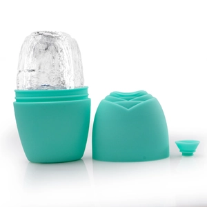 Teal silicone face ice roller mold with base, lid and funnel on a white background