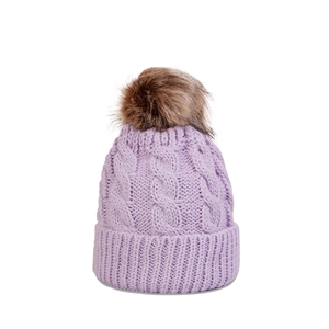 Close-up of lavender cable knit beanie featuring a large fluffy brown faux fur pom-pom detail