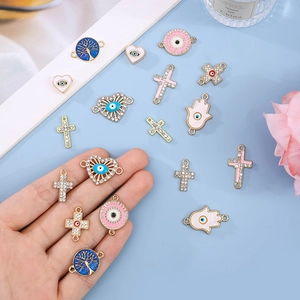 Set of 10 gold plated alloy evil eye charms with cross and hamsa hand for jewelry making