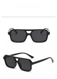 Close-up of retro black oversized sunglasses with double bridge frame from dual view