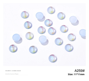 Macro view of 11mm aurora effect iridescent round flatback beads for nail art and DIY