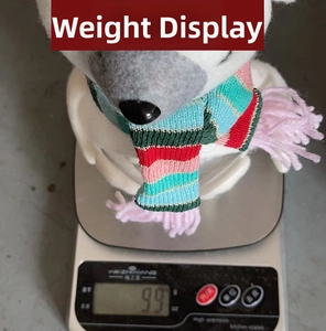 Weight measurement of plush elk candy jar at 99g with colorful knitted scarf detail