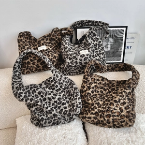 Detail showing plush faux fur texture and stylish leopard patterns on oversized tote bags