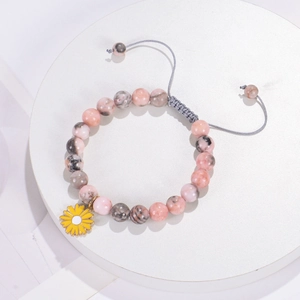 Pink natural stone beaded bracelet with yellow sunflower pendant and adjustable cord