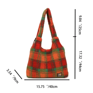 Macro detail of large plaid fleece tote bag with dimension tags and plush texture