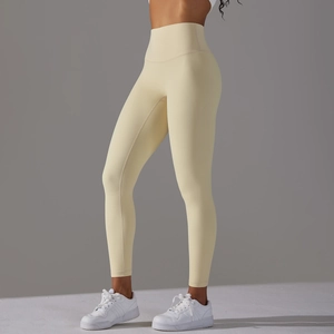Detailed side view of high-waist cream yoga leggings showing tummy control and lifting effect