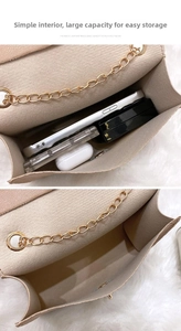 Detail view of the beige chain bag showing spacious interior for phone and cosmetics