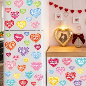 Colorful heart-shaped Valentine stickers with romantic phrases on a white refrigerator