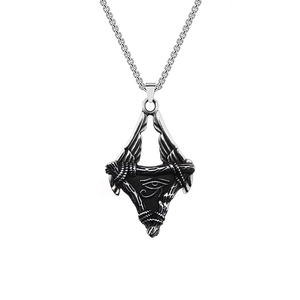Macro shot of vintage silver stainless steel Eye of Horus winged pendant on a metal chain